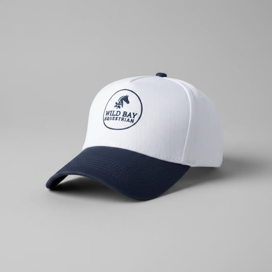 Wild Bay Equestrian two-tone baseball cap in white and navy blue with embroidered logo on the front